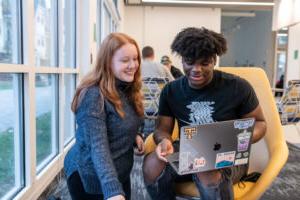 Two Trinity college students engaging in academics